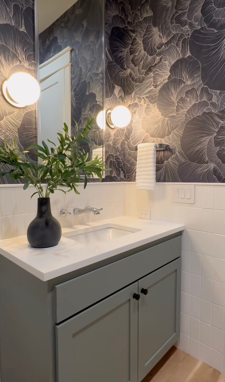 Floating powder room vanity with quartz counter and hex tile floor